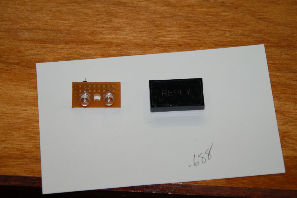 The assembled REPLY indicator next to the LED circuit board.